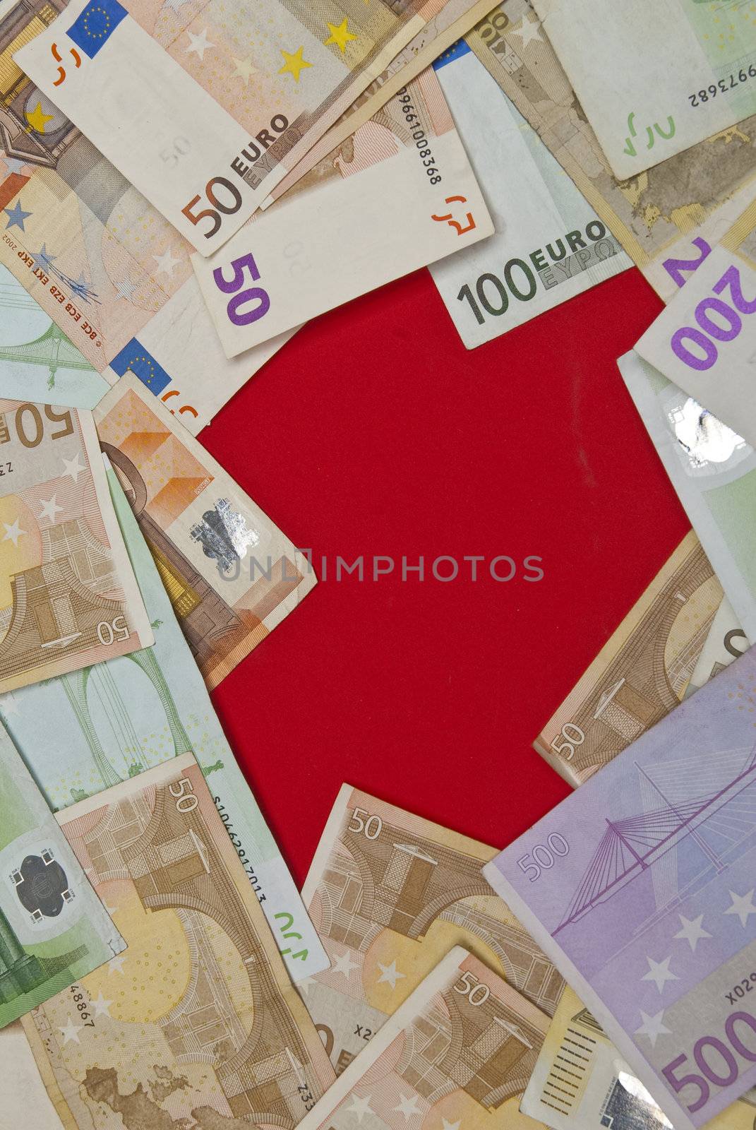 Euro bills on red background,recorded above them.