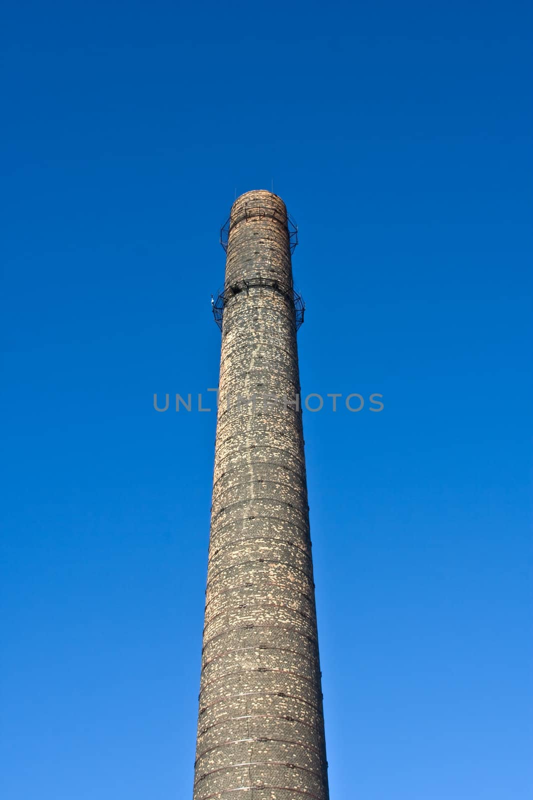 Old chimney-stalk on a background blue sky