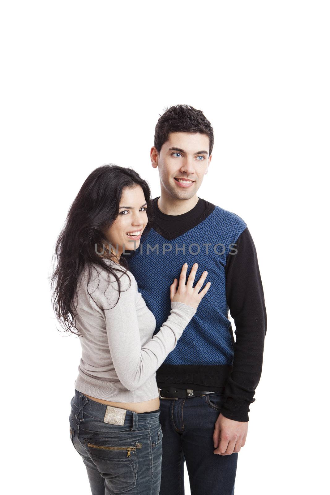 Attractive young couple standing over a white background