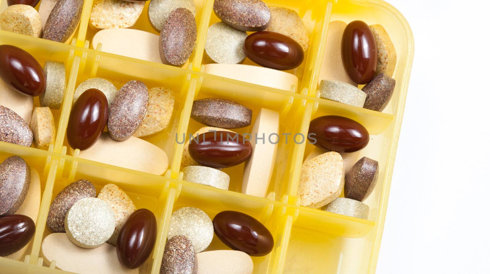 Supplements food in the form of pills isolated on white.