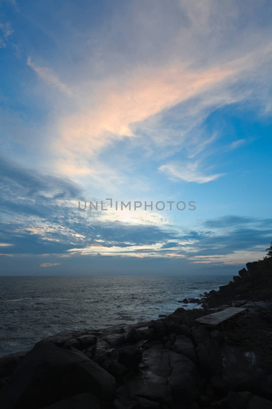 Rocky coast at sunset. Unawatuna, Sri Lanka