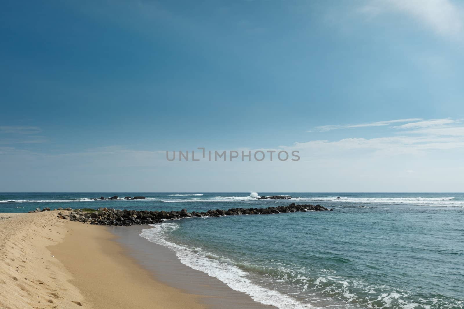 Wave breaker on beach by dimol