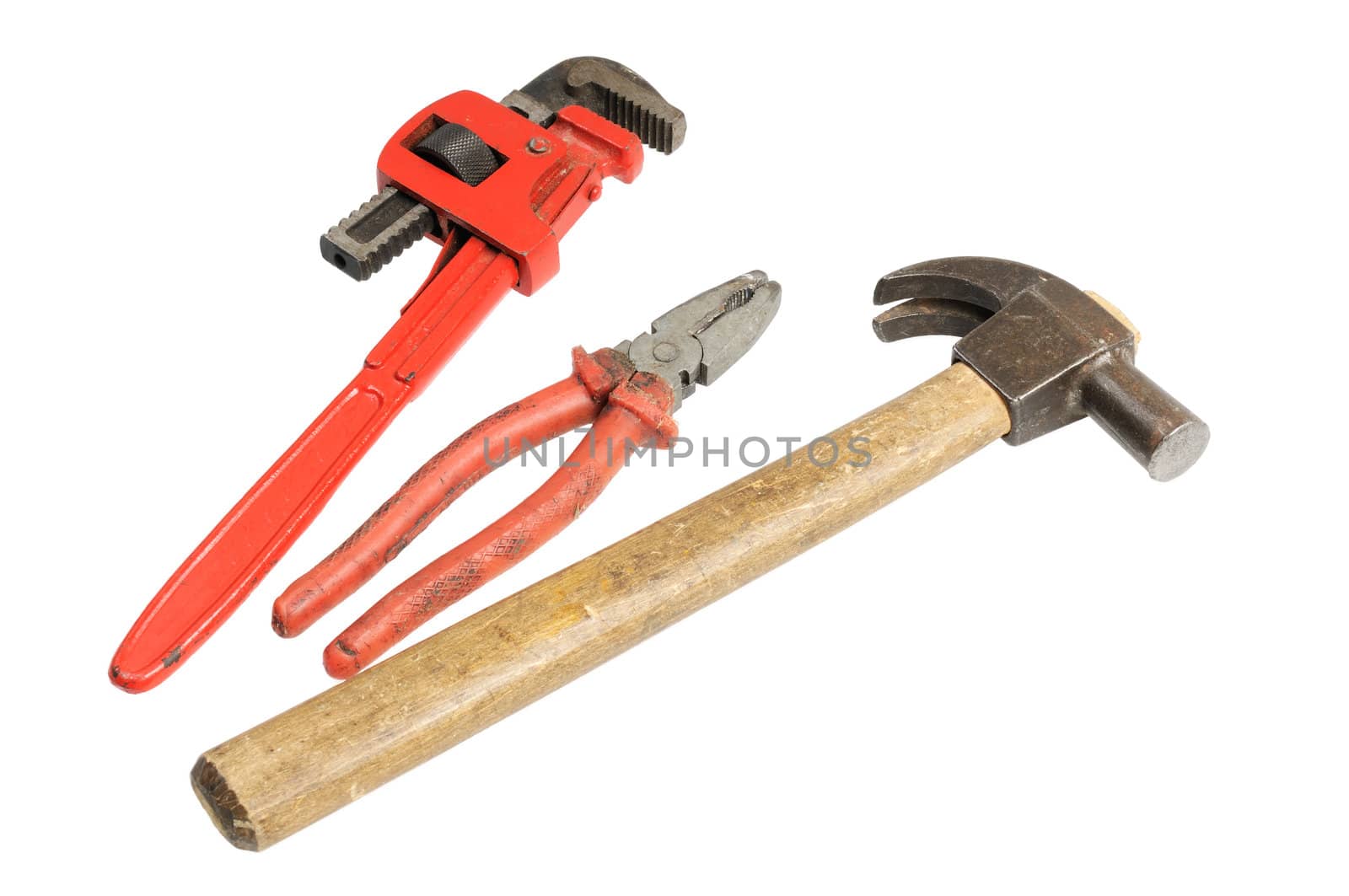 The old tools. Hammer, wrench and pliers. Isolated on white.