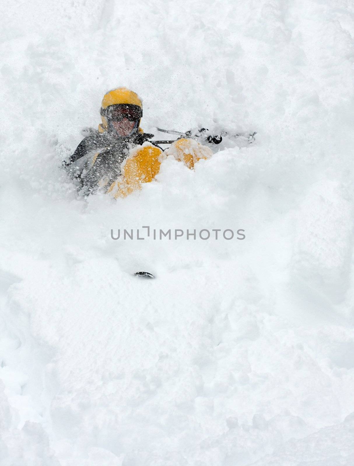 Skier falling over in deep snow