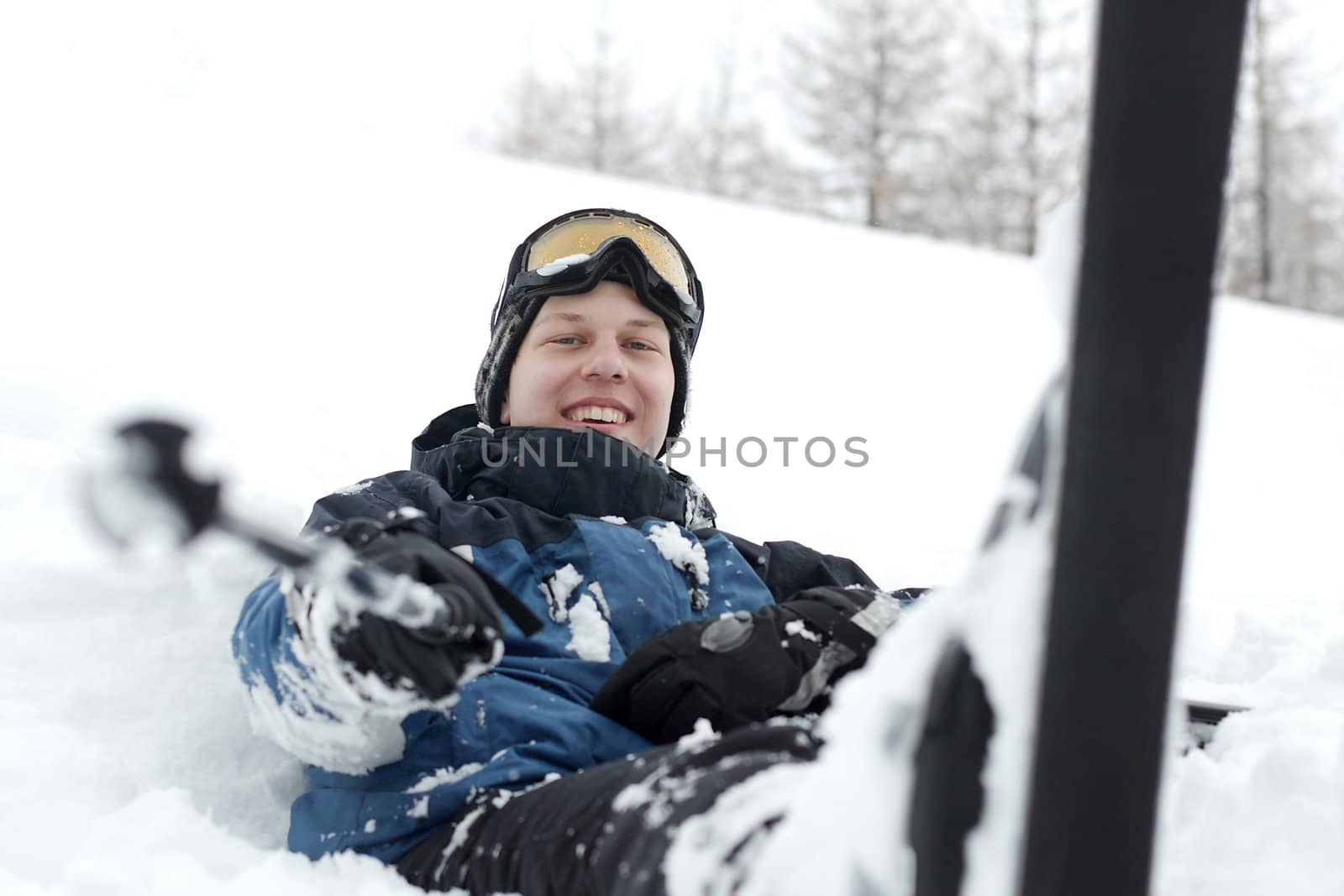 Skier resting in the snow