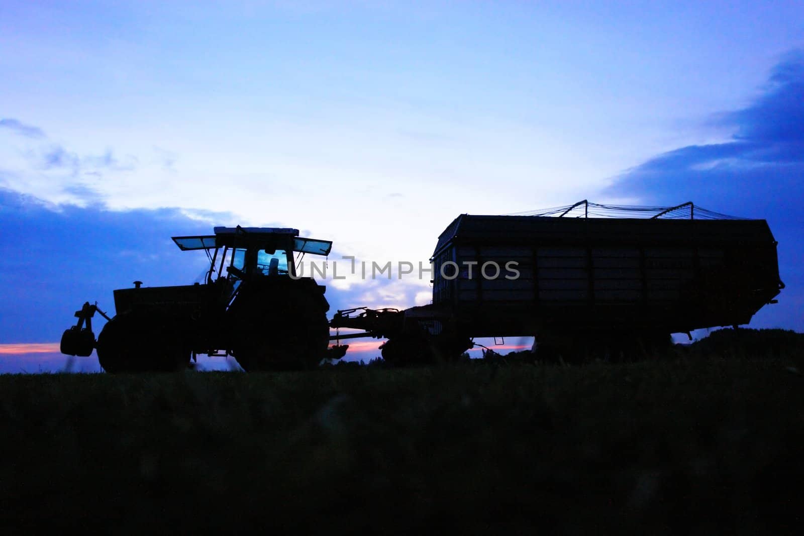 The Tractor - modern farm equipment in field