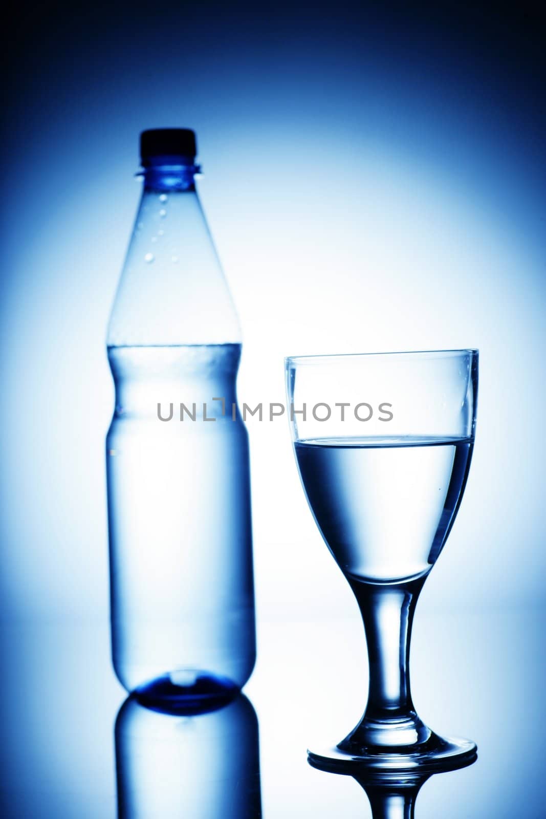 water bottle on a shiny surface in studio