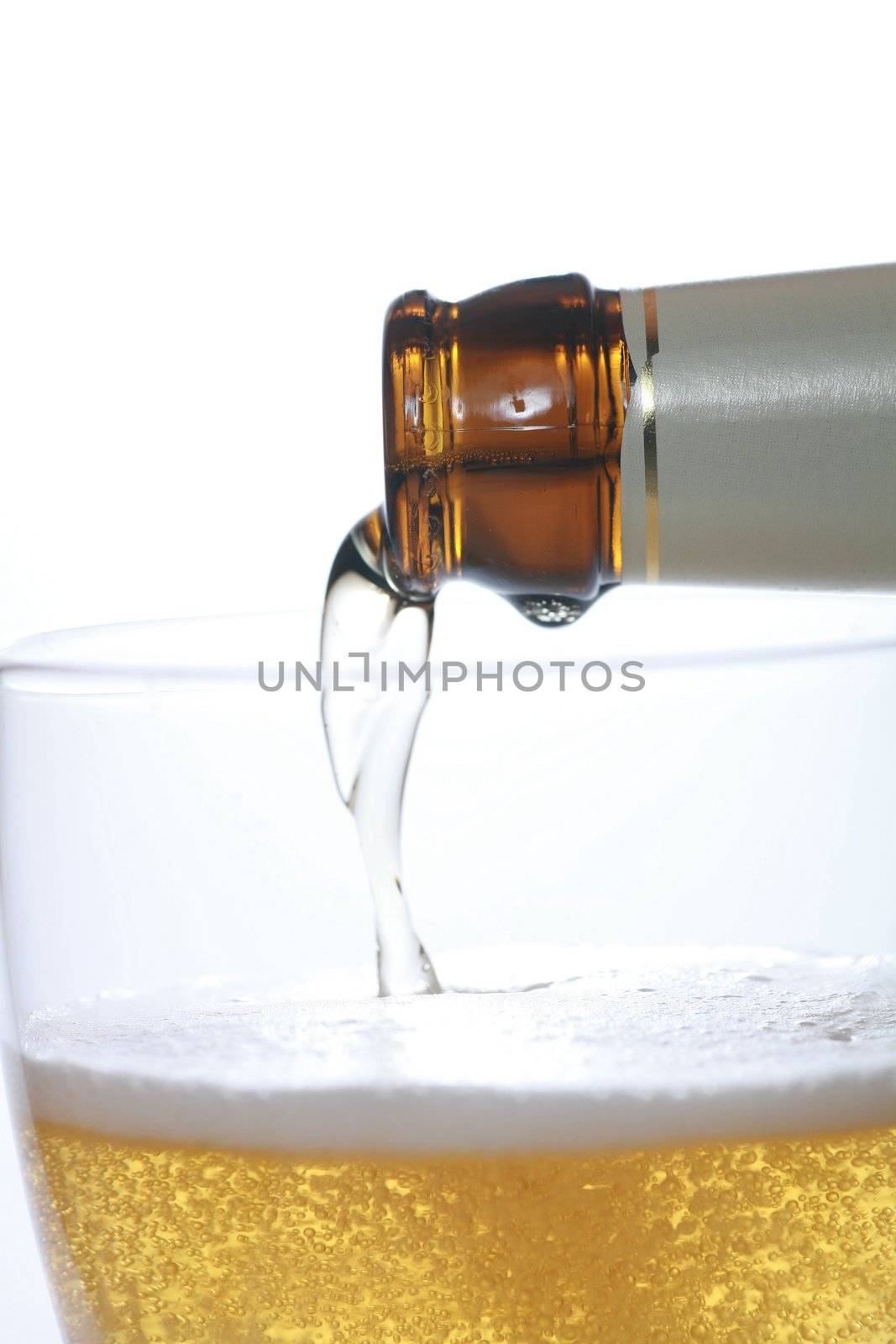 Detail of a beer in a glass with foam