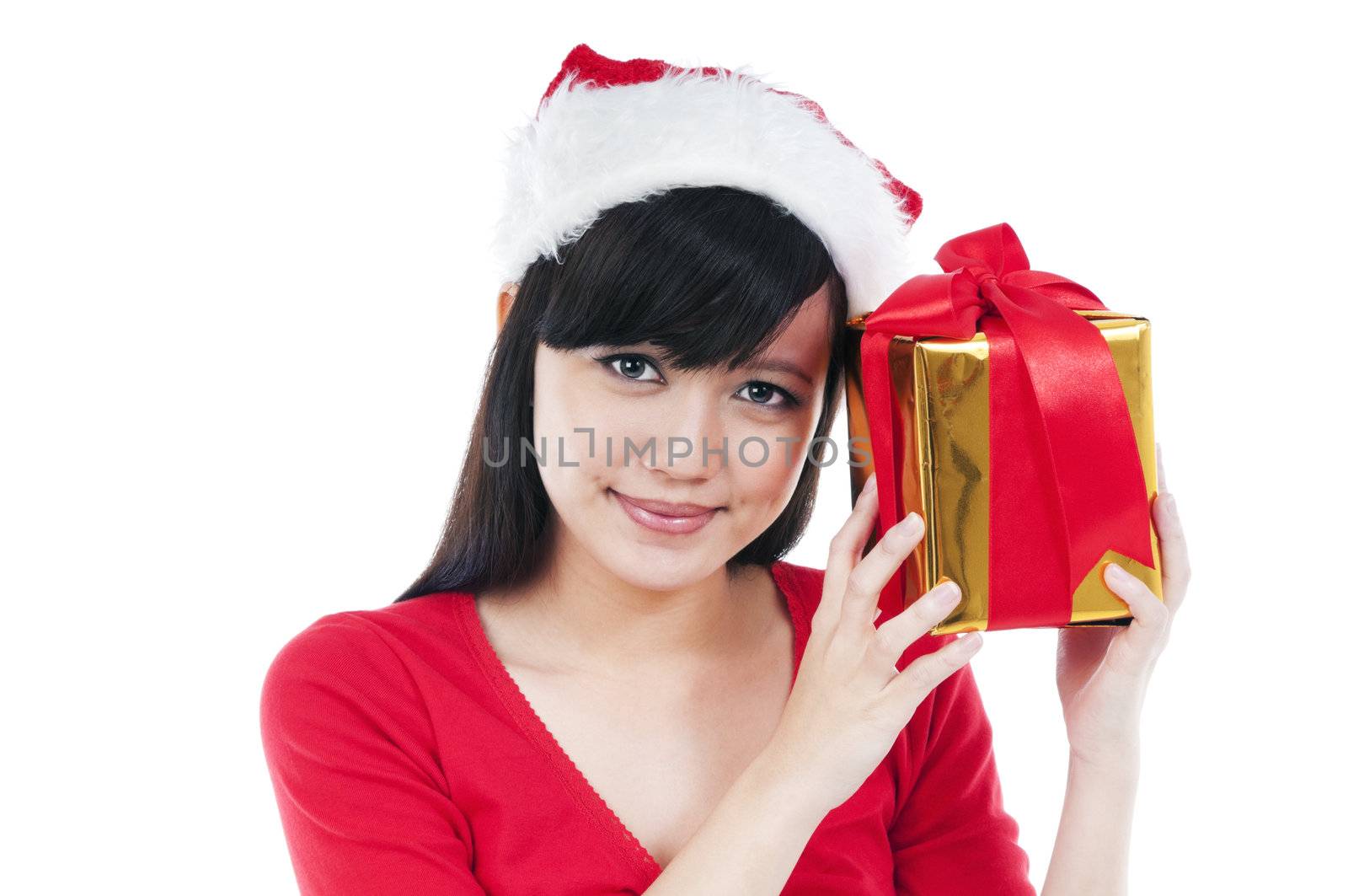 Portrait of a beautiful Christmas woman holding a gift box against white background