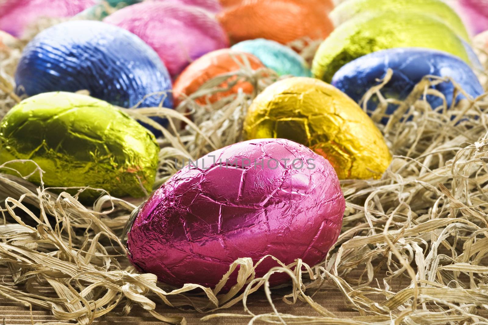 Colorful easter eggs in straw by tish1