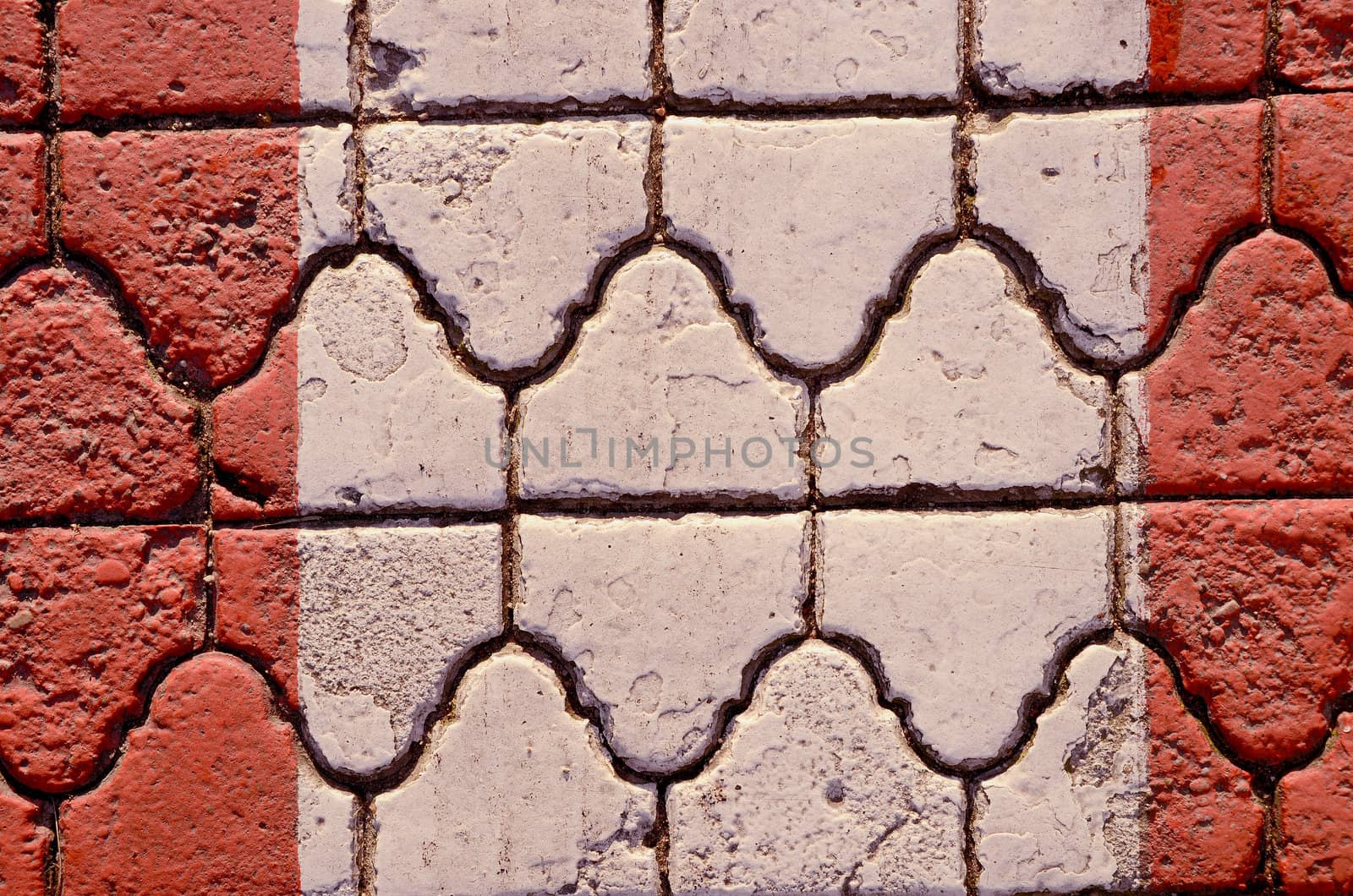 Wall fragment built of intresting bricks. Architectural background.