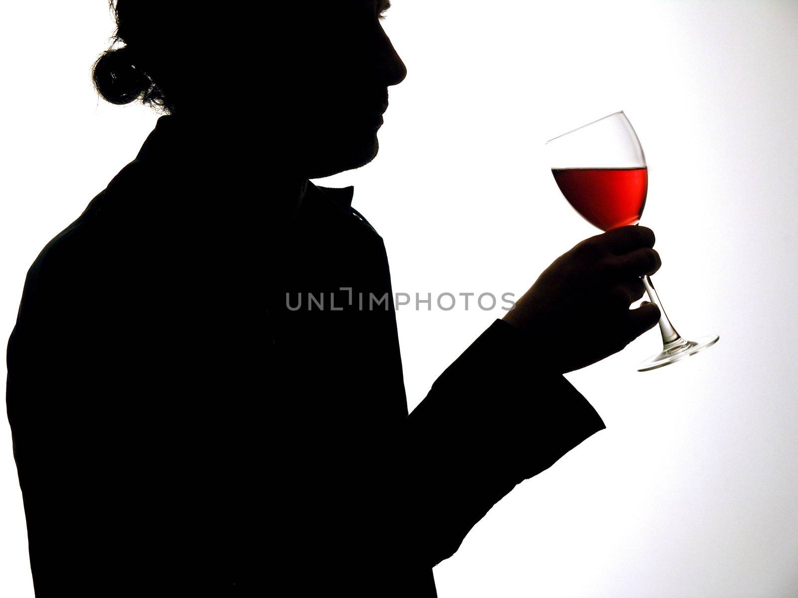 Man with wine glass in silhouette