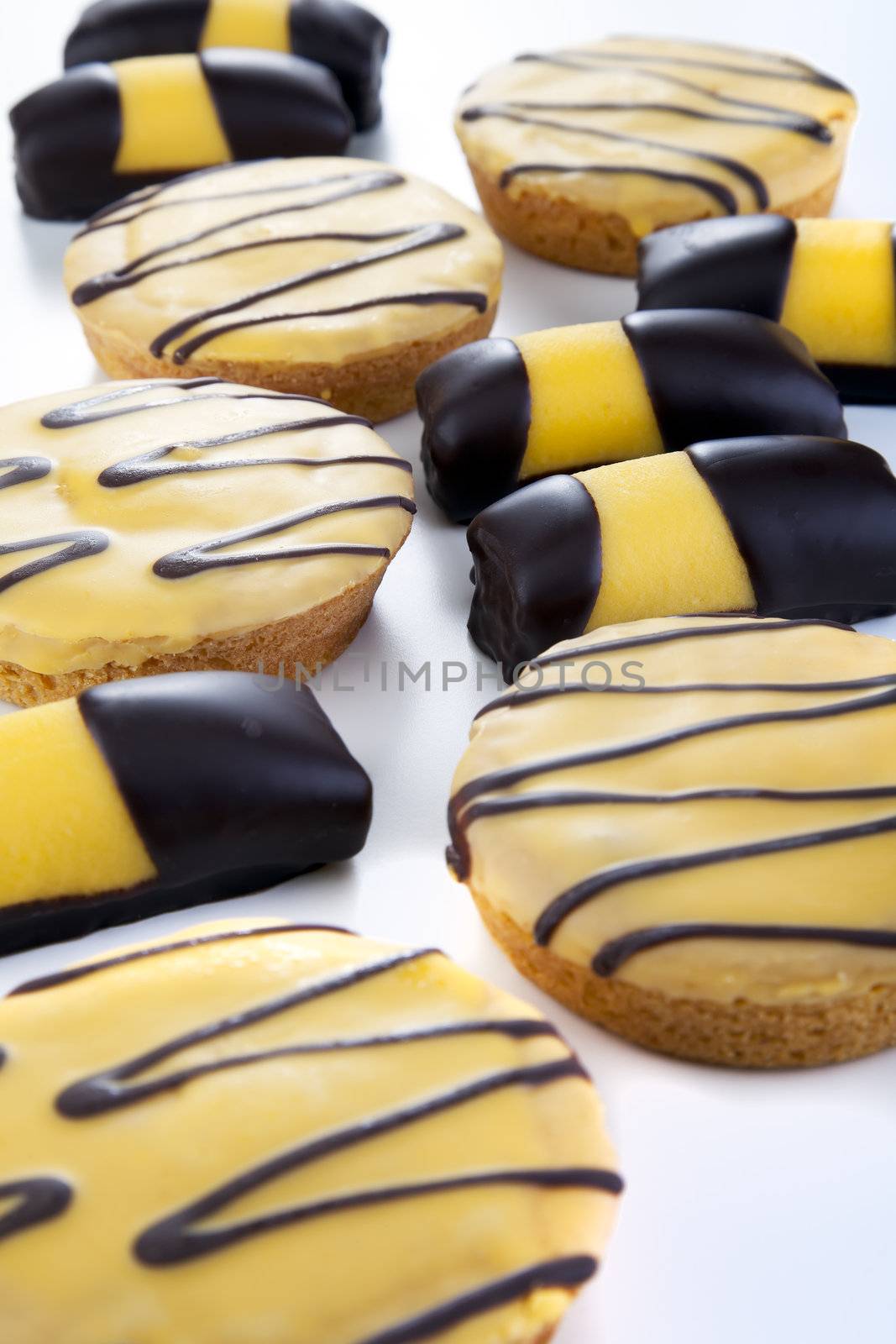 Variety of Dutch sweets served at Easter with yellow and chocolate toppings.