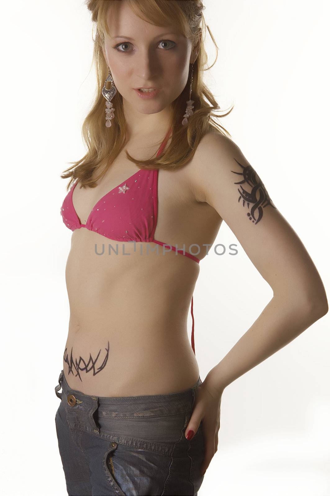 Blonde Girl with tattoo posing and smiling