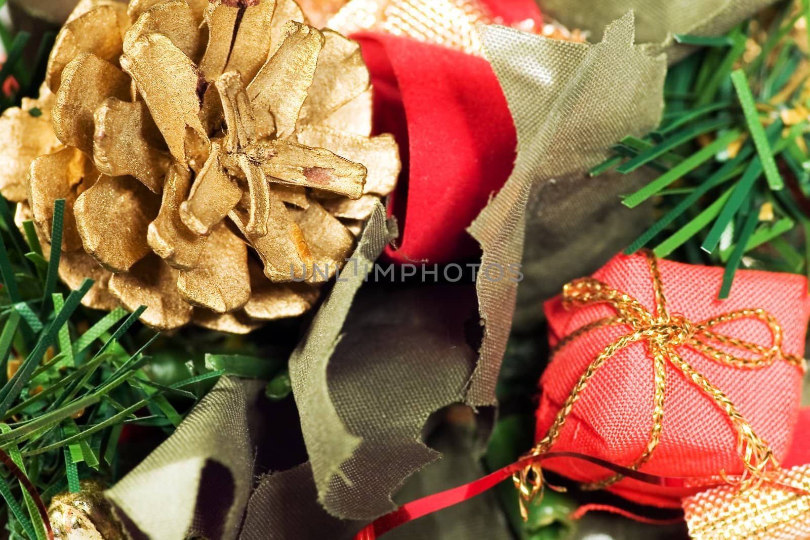 Christmas decoration with golden cone and fir and gift