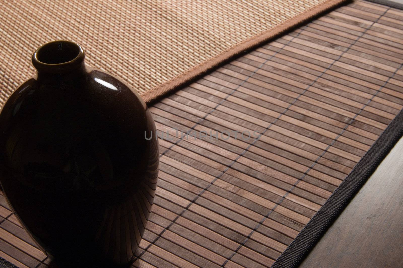 Pretty ceramic jug on a bamboo napkin