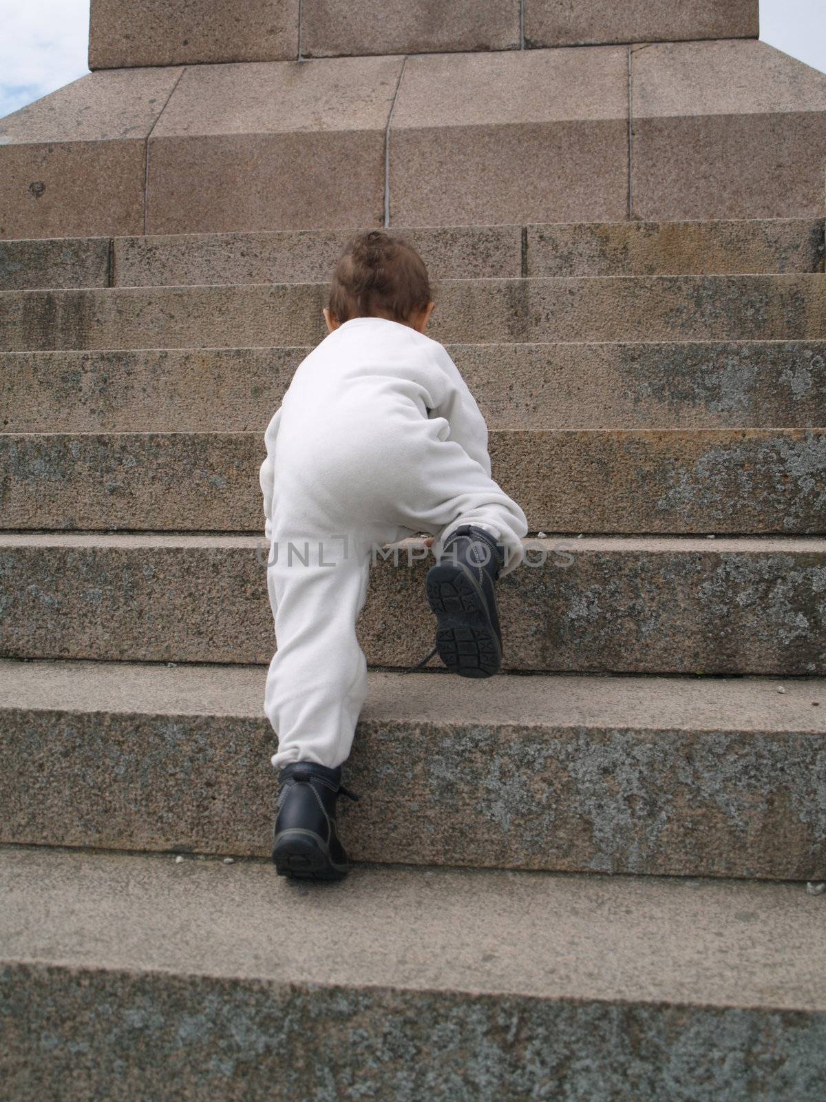 toddler moving up staircase