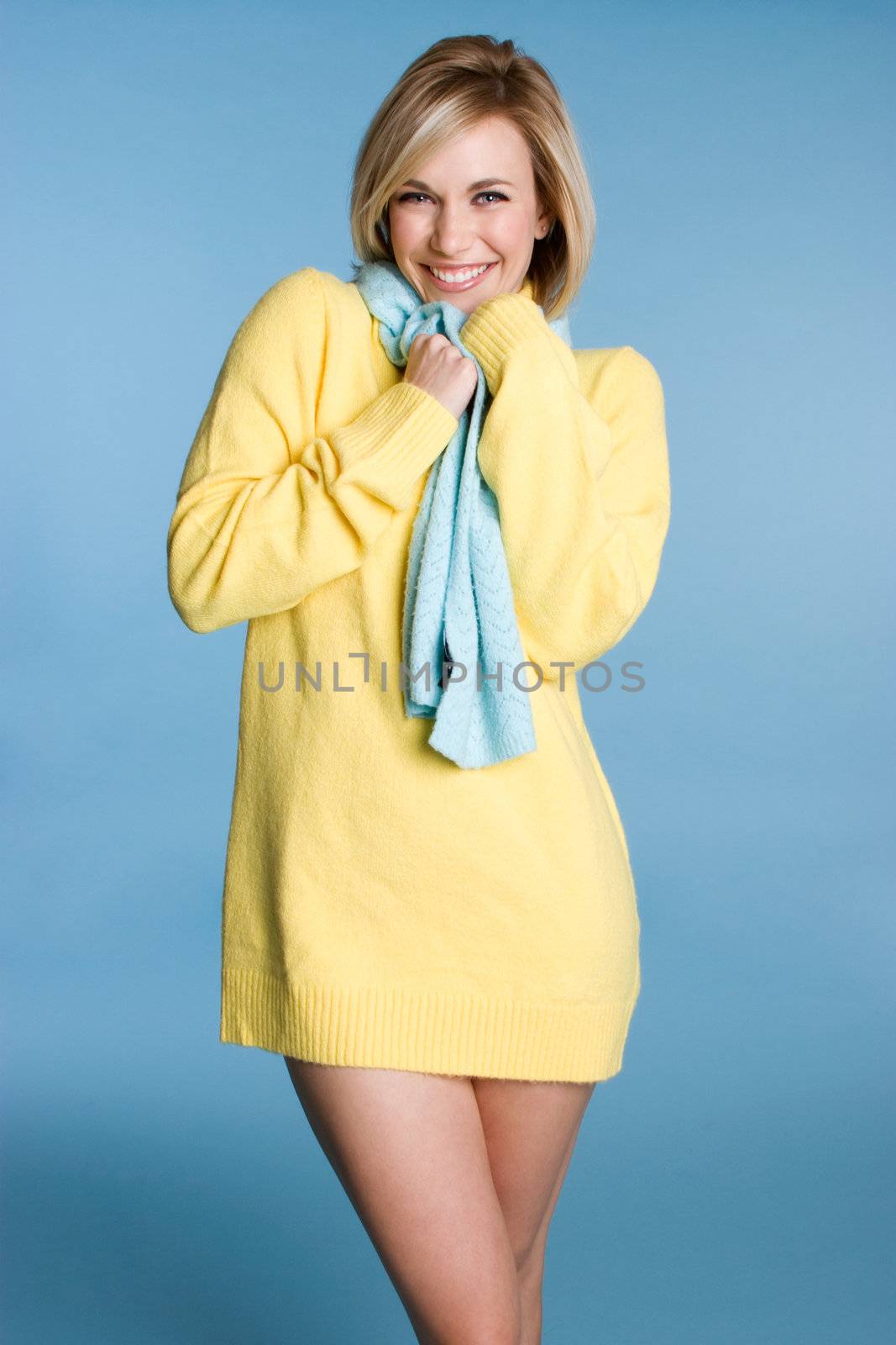 Smiling woman wearing yellow sweater