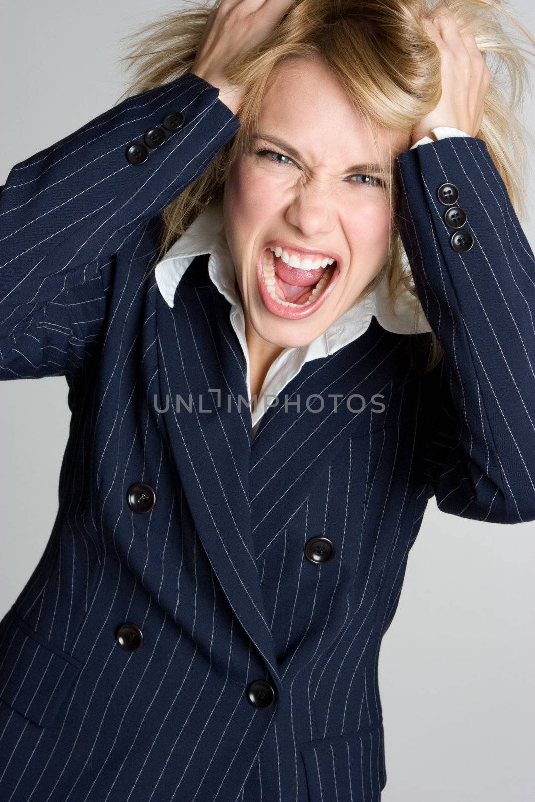 Beautiful frustrated angry businesswoman yellling