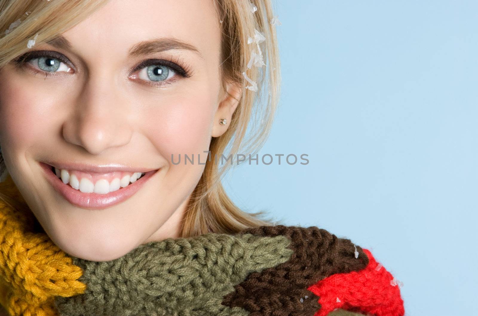 Smiling woman wearing winter scarf