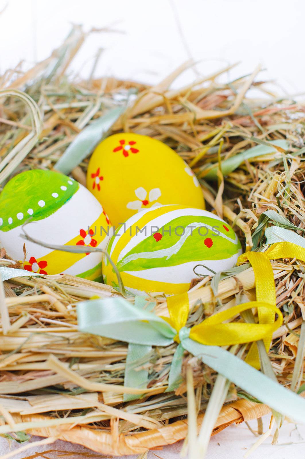 Closeup basket with colorful Easter Eggs by maxoliki