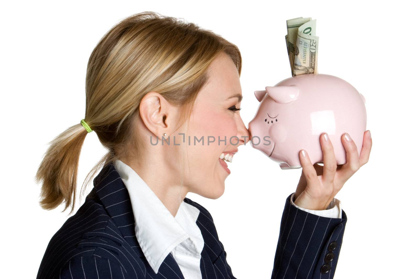 Smiling woman holding piggy bank