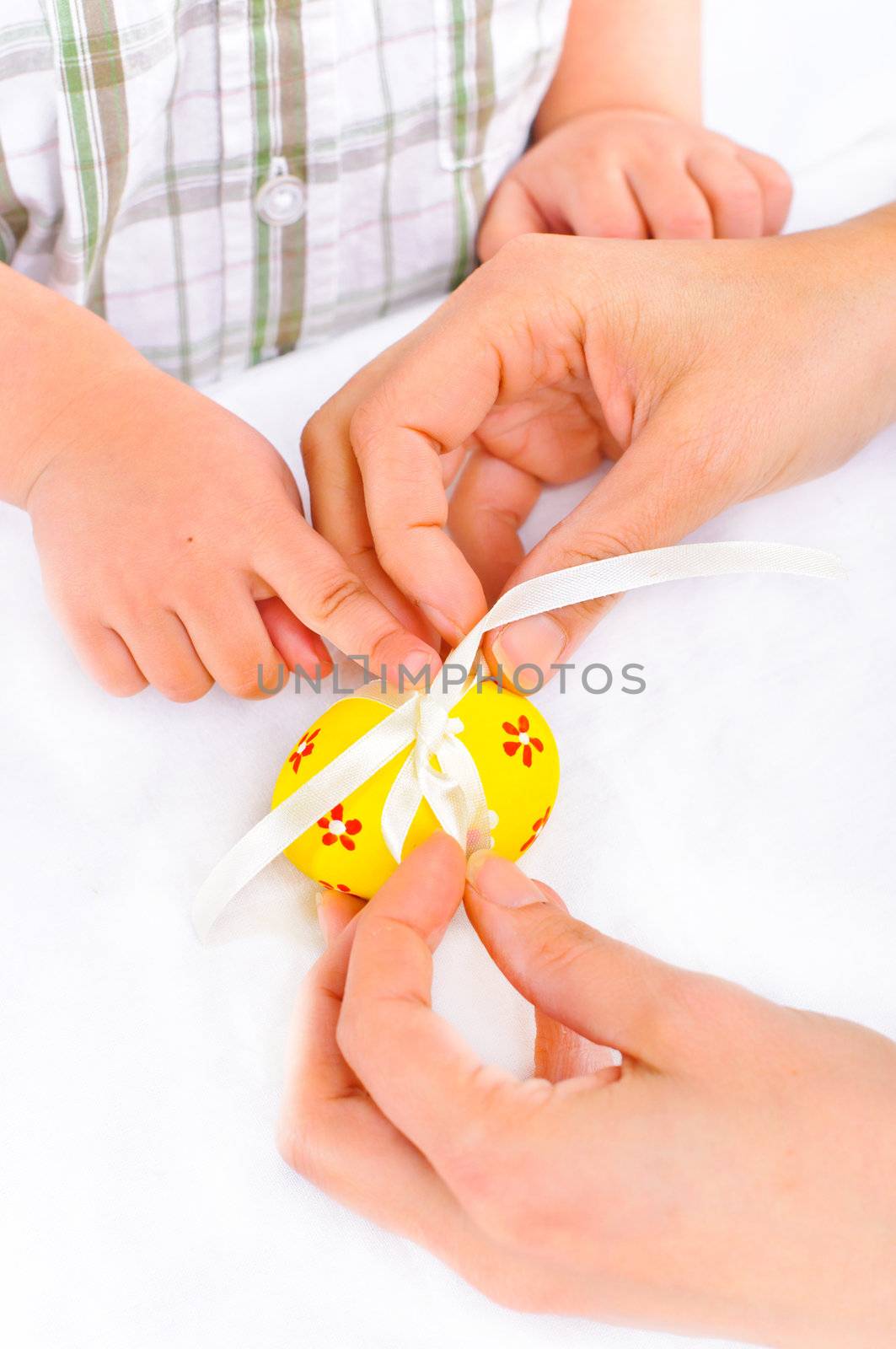 For Easter eggs. Women's and children's hands close-up