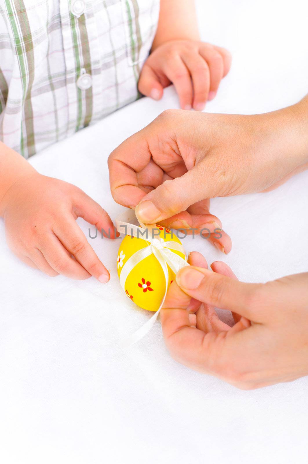 For Easter eggs. Women's and children's hands close-up