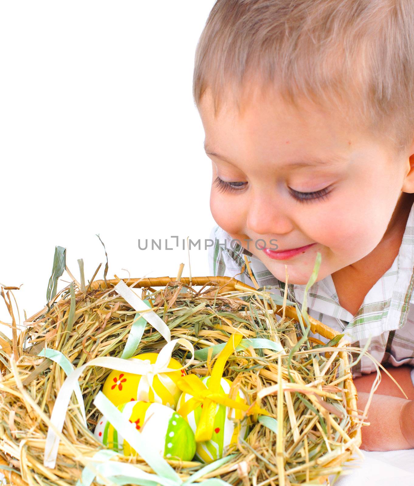 Little boy with easter eggs in basket by maxoliki