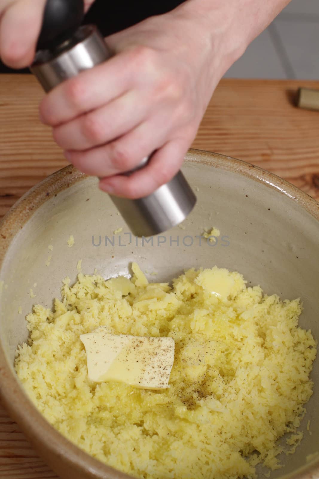 preparing creamy mashed potatoes in a  bowl