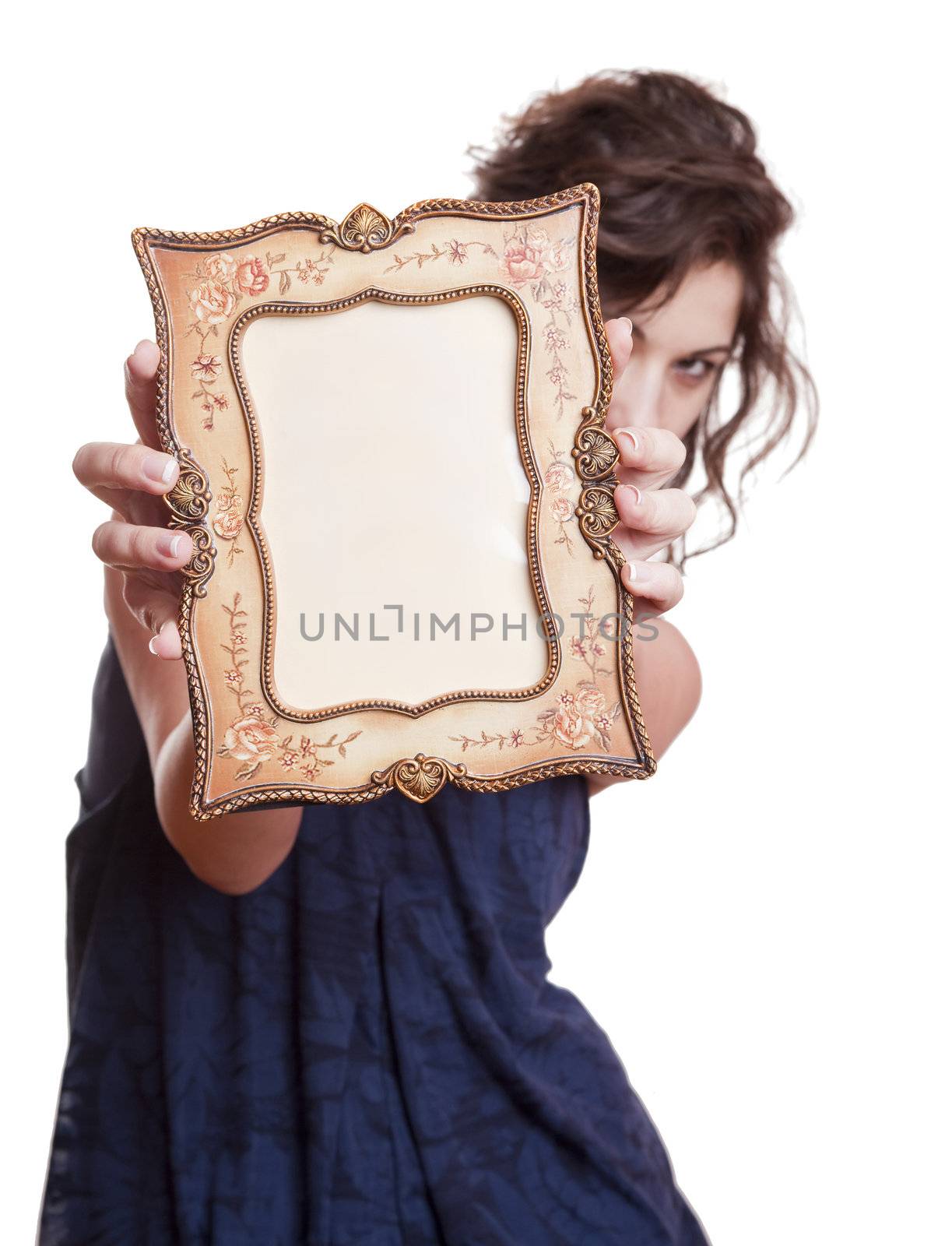 Woman hiding face with an picture frame