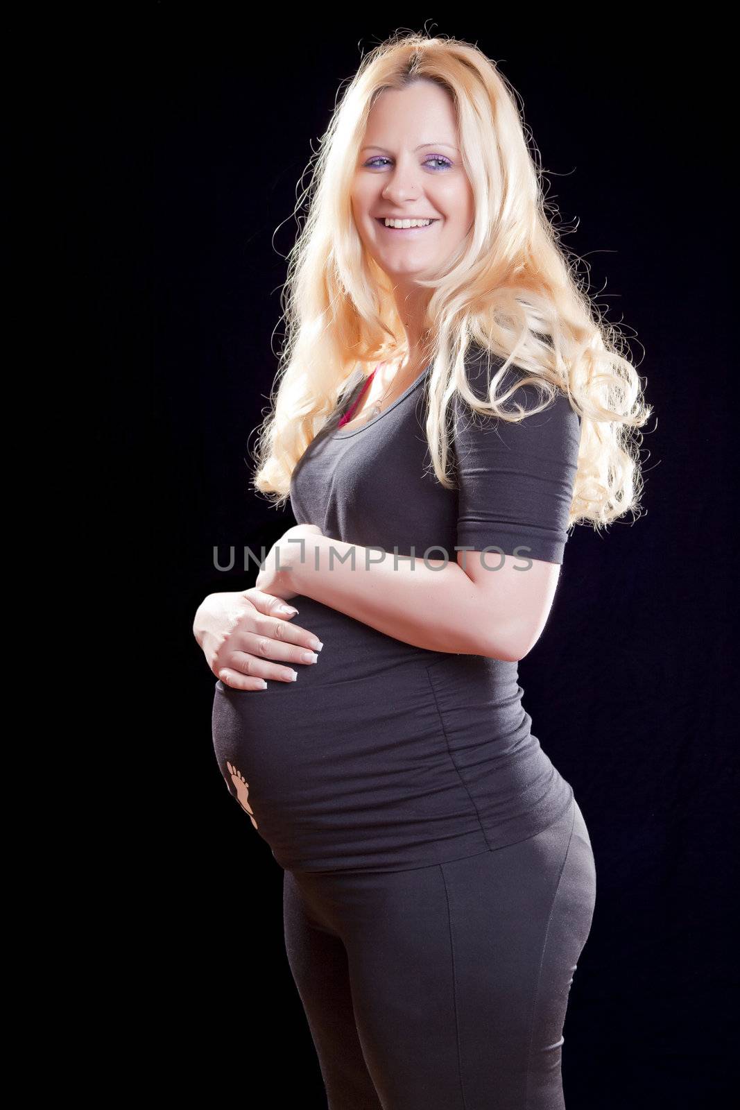 Pregnant woman holding tummy by adamr
