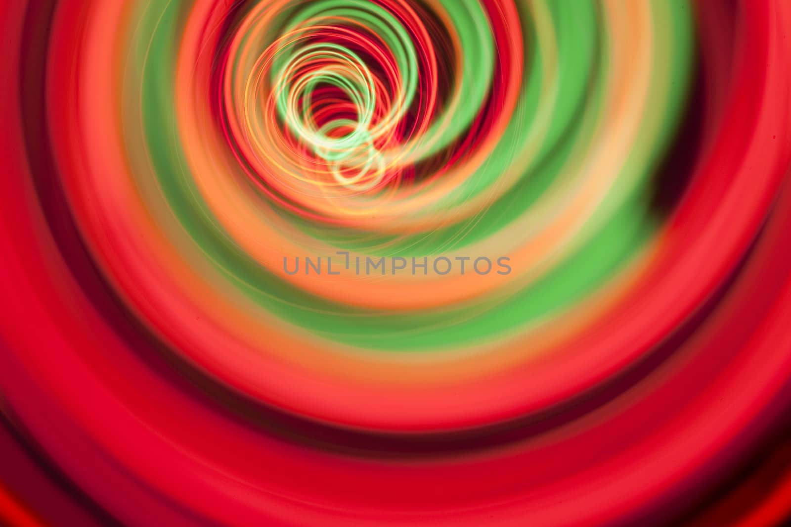 vividly colored red and green spiral of light created in camera