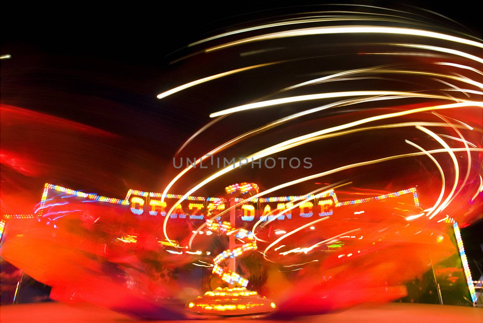 Blur neon lights in amusement park, long exposure