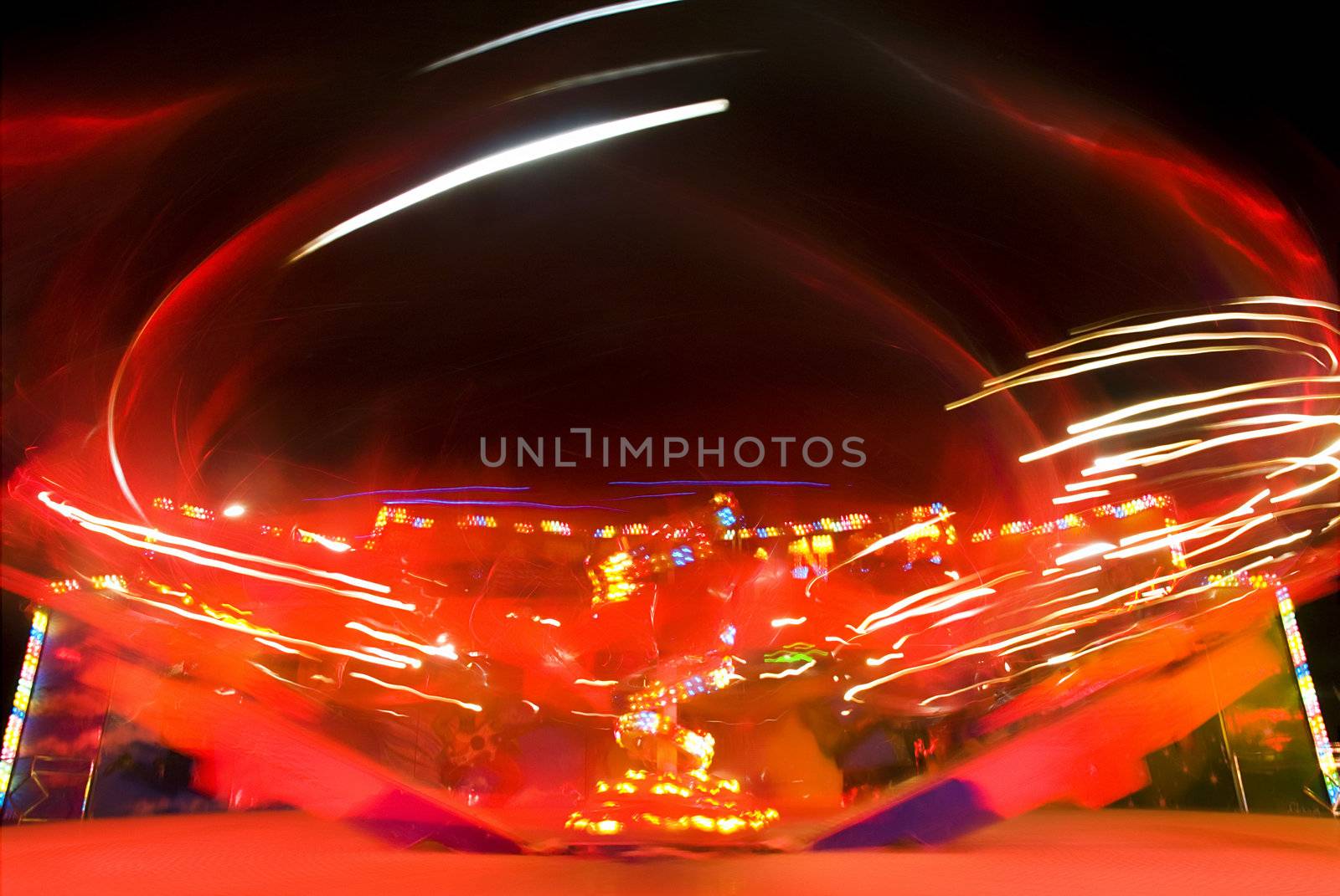 Blur neon lights in amusement park, long exposure