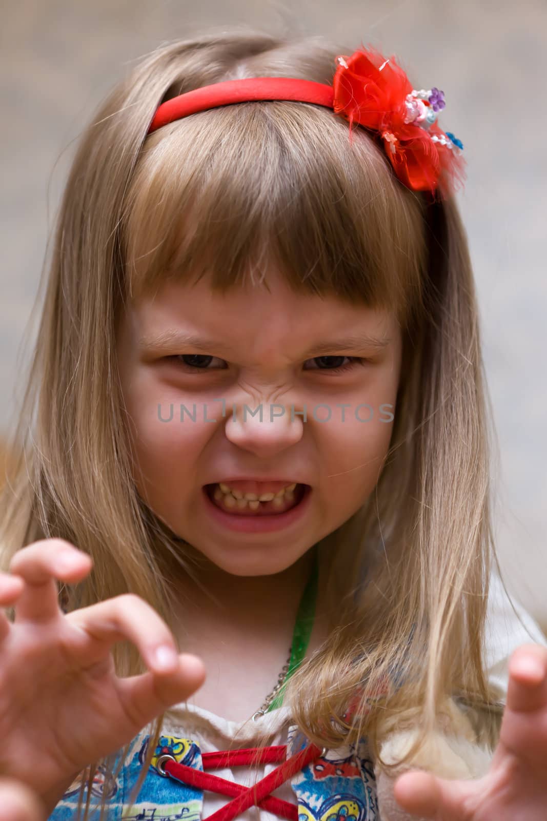 The girl poses terrible mugs with desire strongly to frighten
