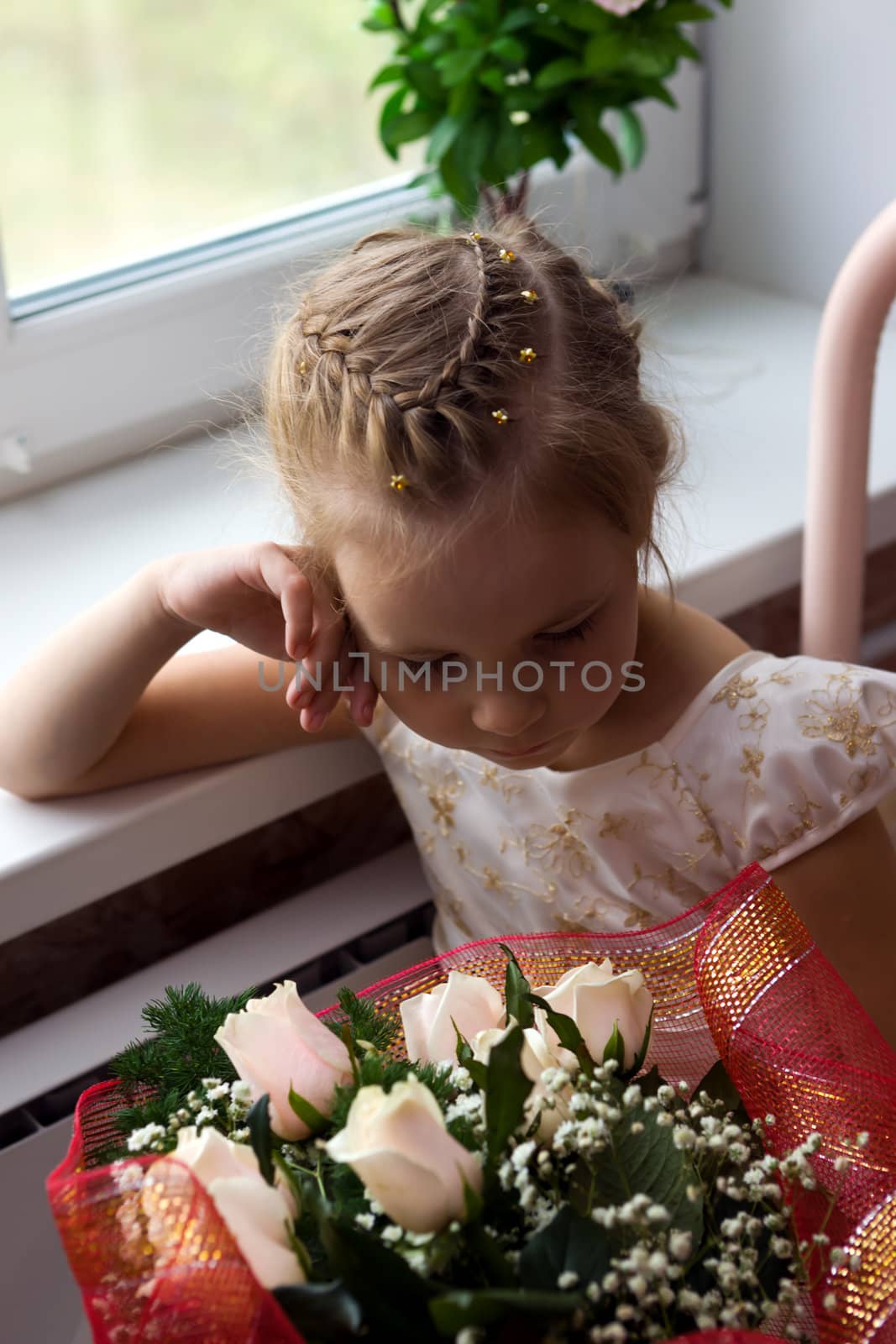 The sad girl with a bunch of flowers
