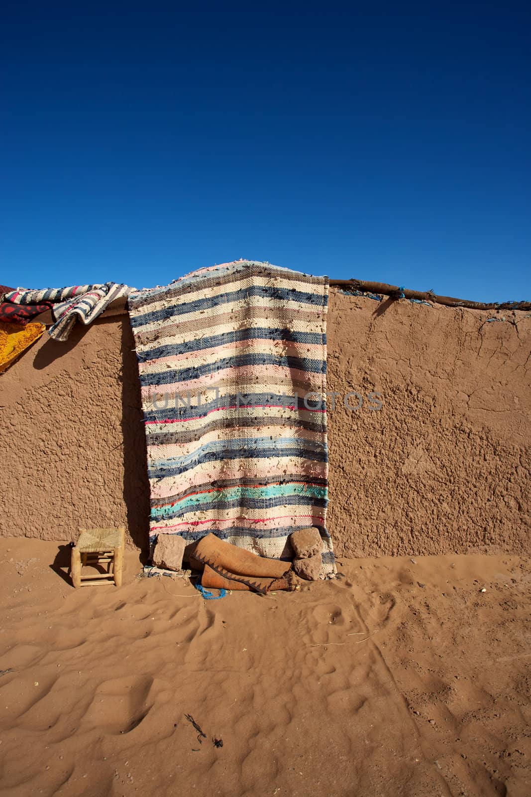 Tradional Berber house with door near the dunes of Merzouga