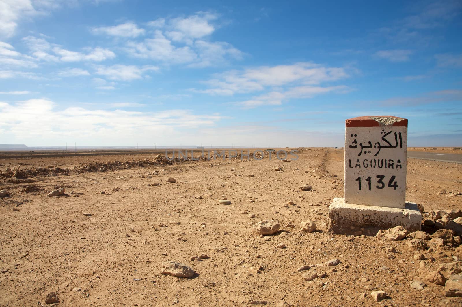 Road Sign to Lagouira in Morocco with blue sky