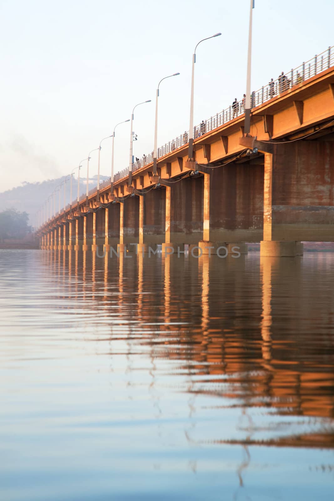 Pont des martyrs Bridge in Bamako - On the river the Niger with a beautiful sunset and people walking