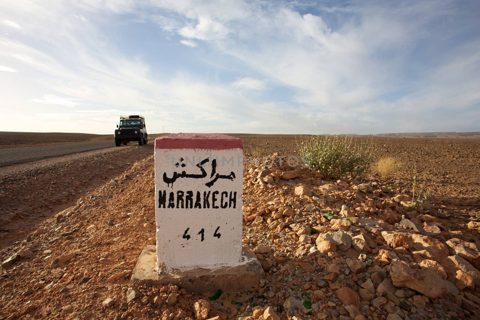 Road Sign to Marrakech in Morocco with blue sky