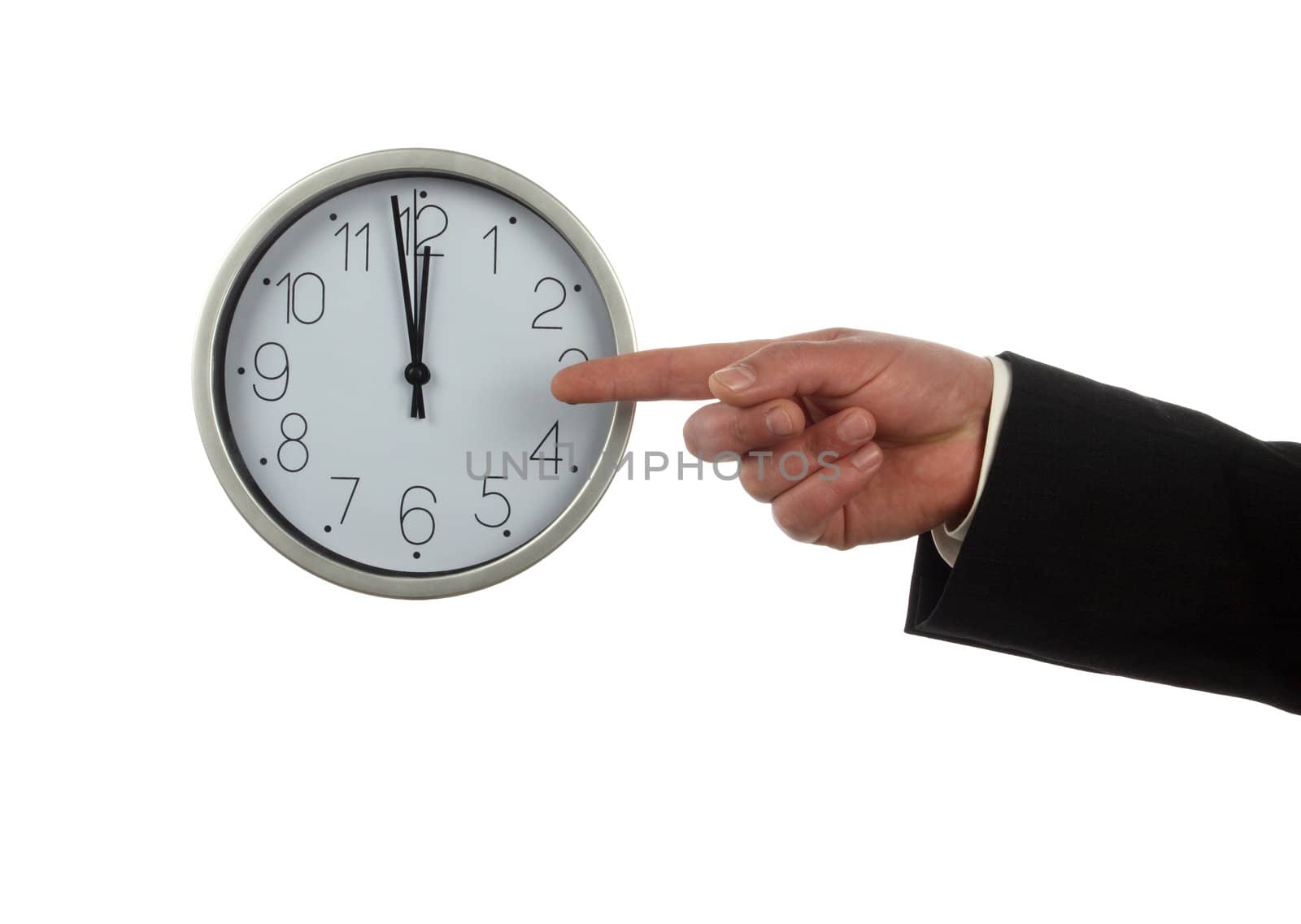 Businessman pointing at  big clock. Time for work concept 