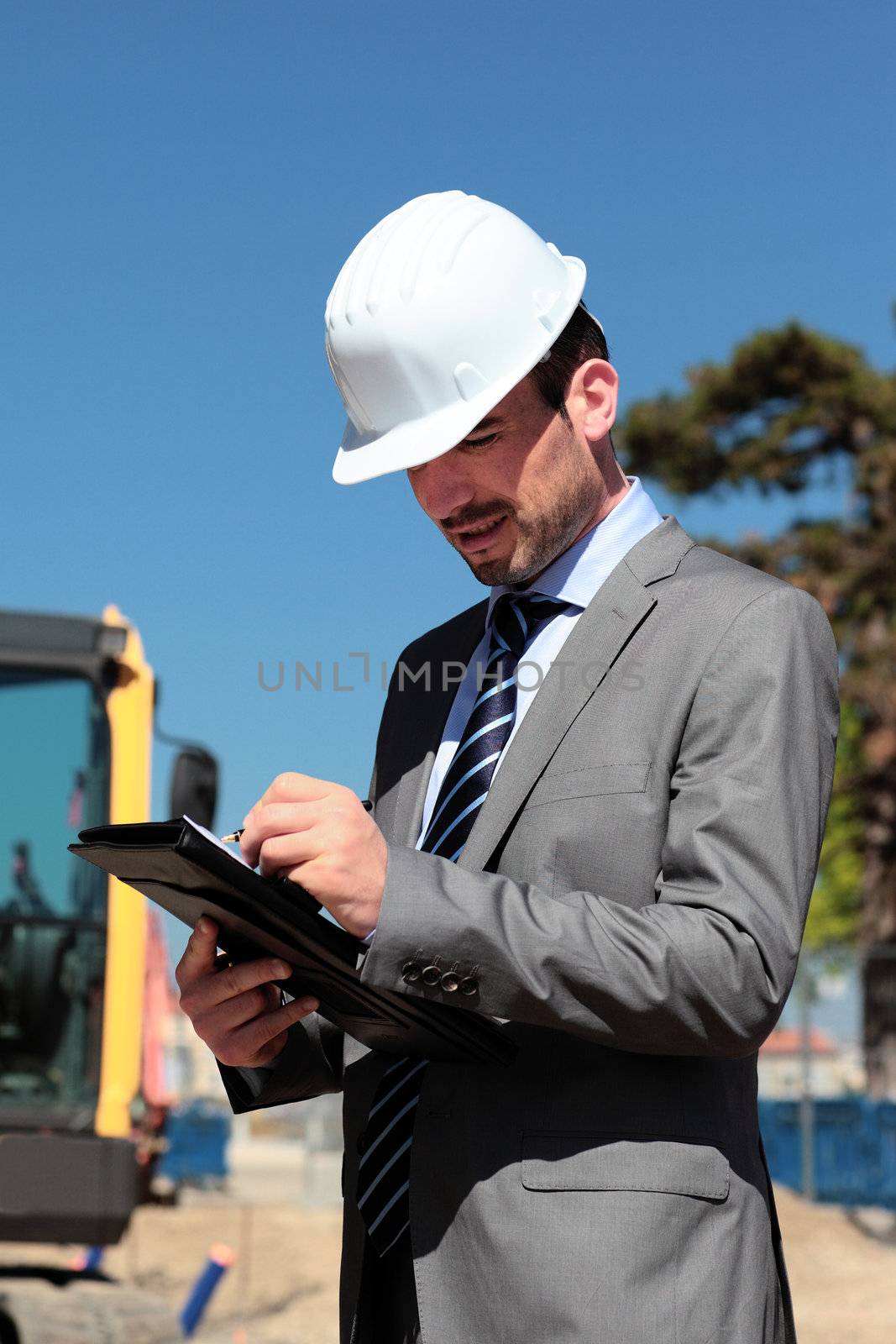 on building site with hardhat by vwalakte