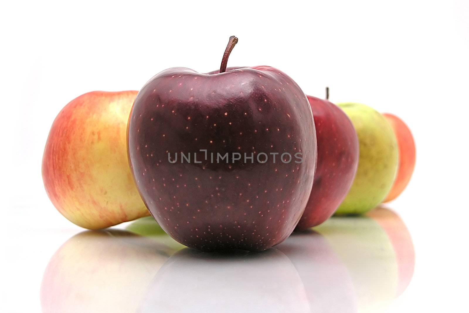 Several apples on white glass