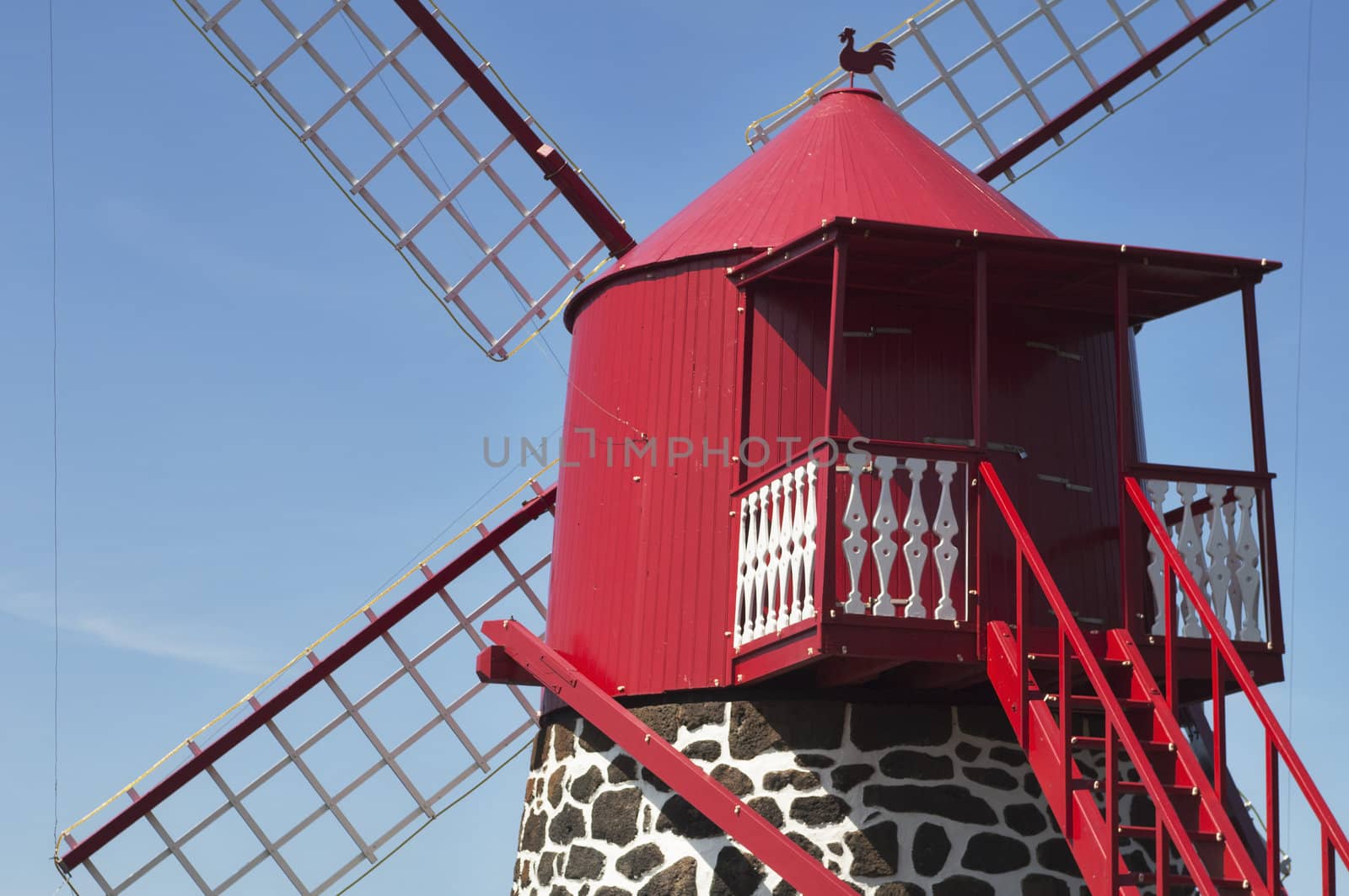 Red windmill in the coast of Pico island, Azores