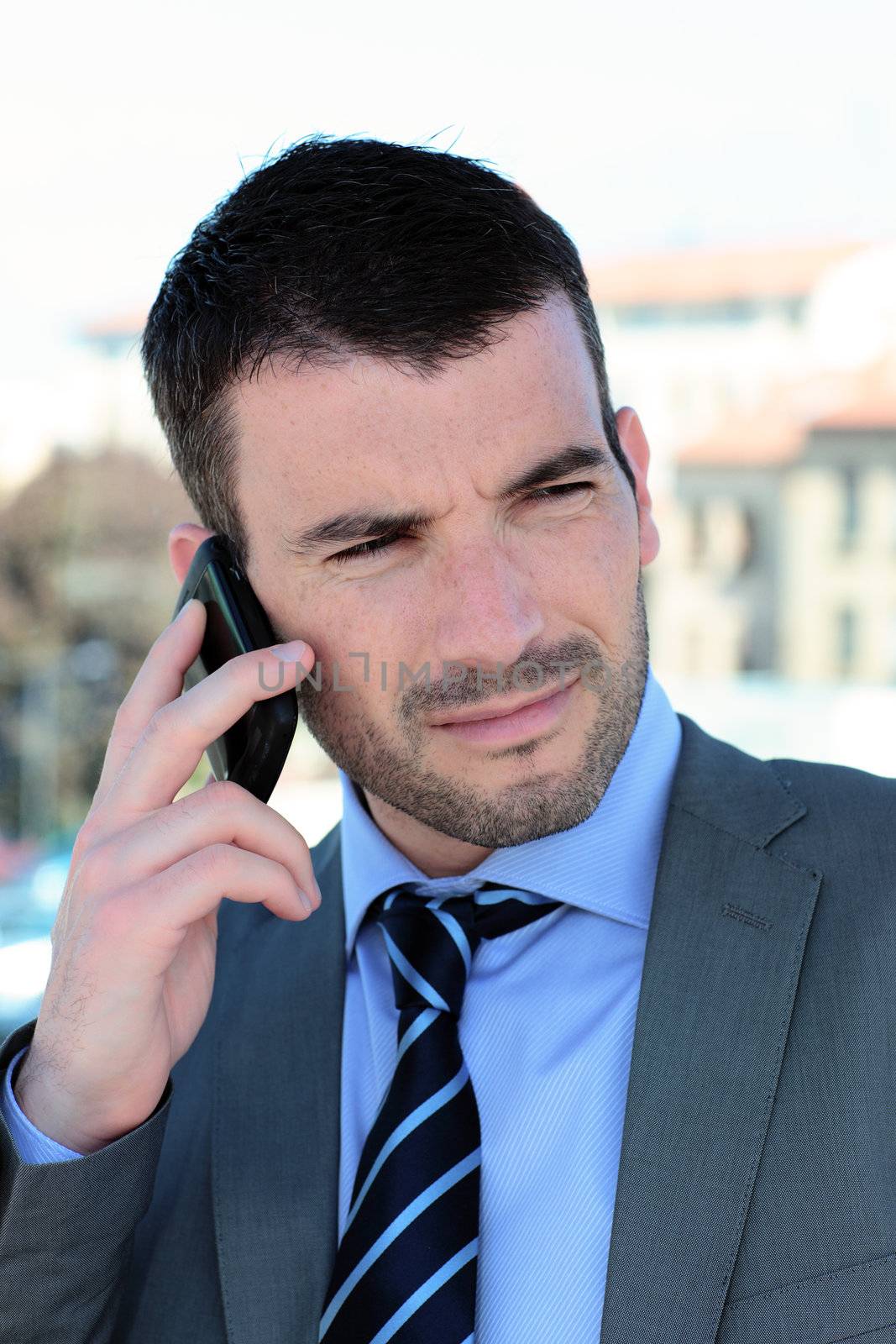 businessman on the phone outdoor in autumn