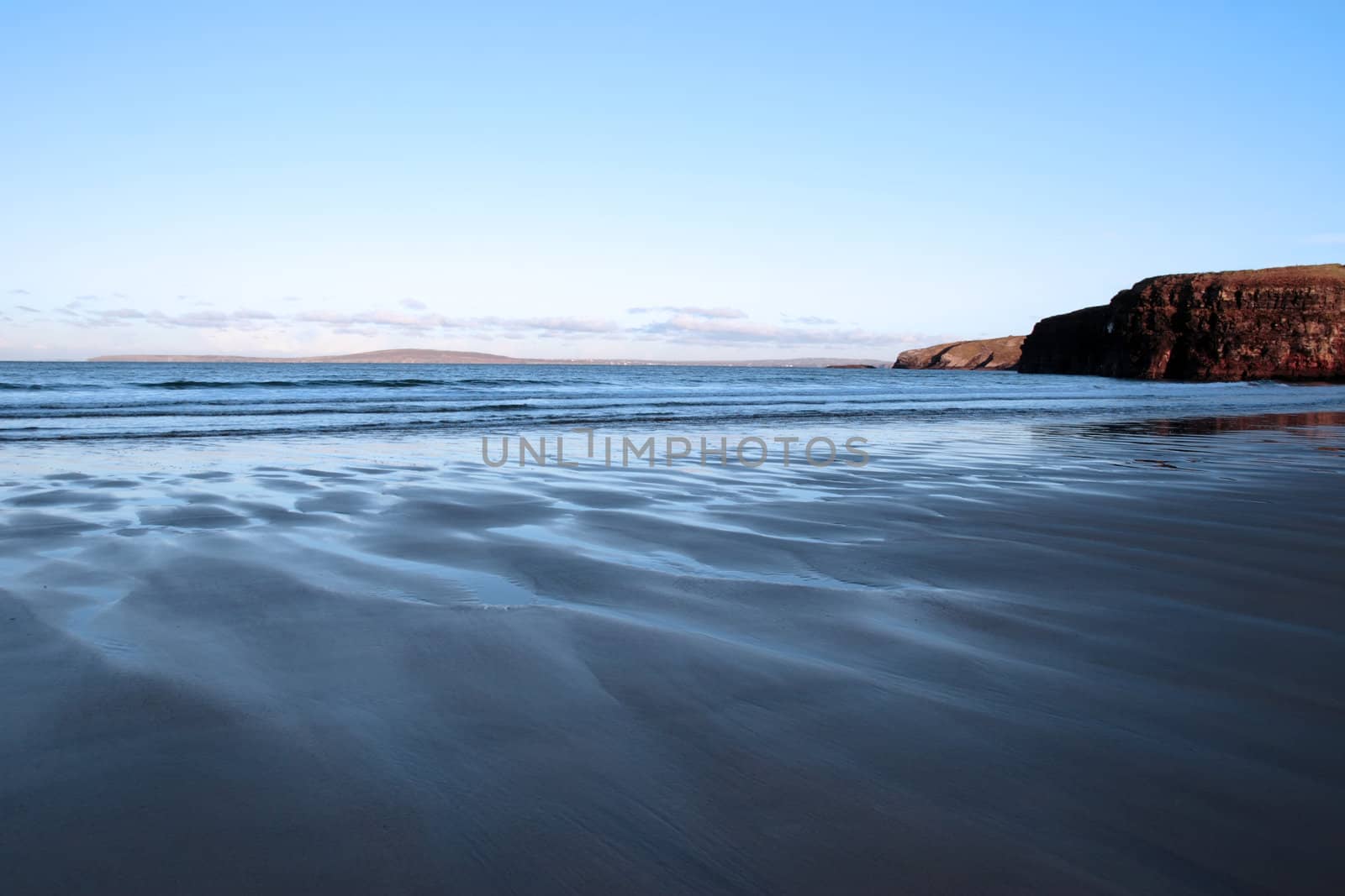 a view of the beach cliffs in ballybunion co kerry ireland on a cold winters day