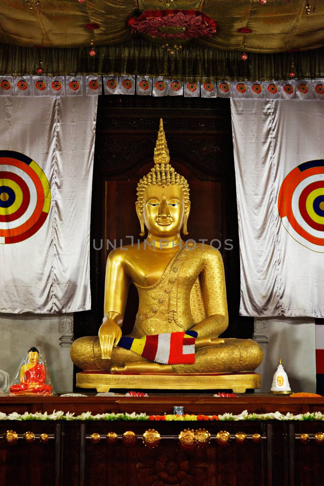 Sitting Buddha statue in Temple of the Tooth. Kandy, Sri Lanka