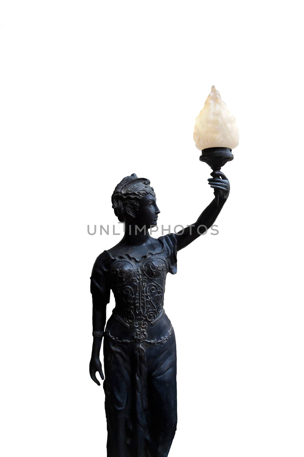 A statue isolation of a bronze woman holding a torch