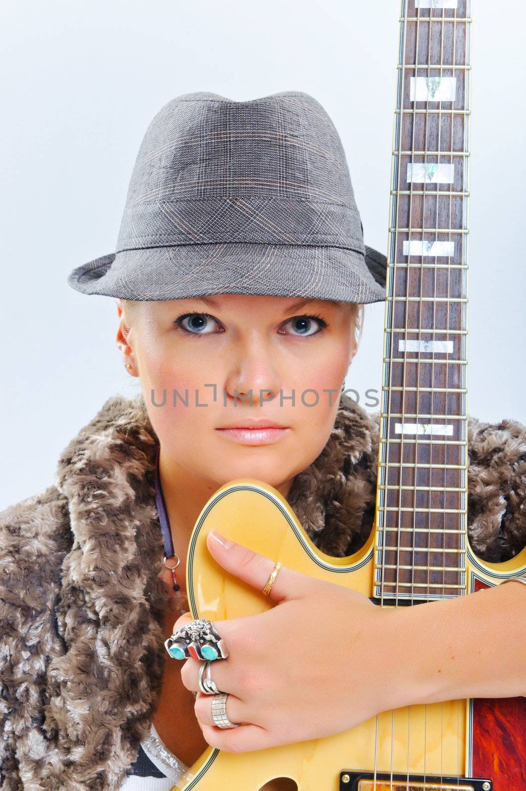 Young beautiful country music guitar girl smiling